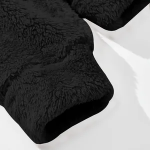 Macro view of the high-quality soft fleece texture and cuff detail of a warm winter jacket.