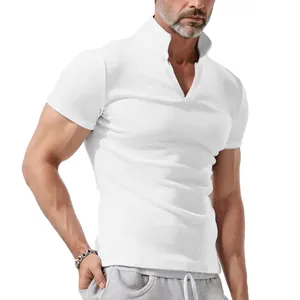 Detailed view of the V-neck and stand collar design on a white men's short sleeve polo shirt.