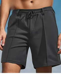 Detailed view of breathable men's sports shorts with drawstring waist and textured fabric