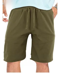Detail view of men's loose olive green sports shorts for summer fitness and casual wear.