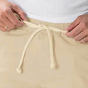 Men's khaki drawstring cargo pants featuring an elastic waistband and casual style.