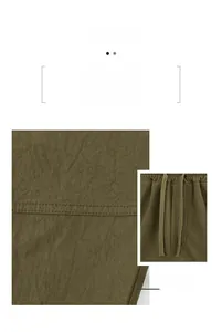 Close-up of olive green sports shorts showing fabric texture and drawstring waistband