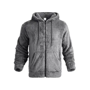 Close-up detail of a soft gray plush fleece zip-up hoodie showing texture and pockets