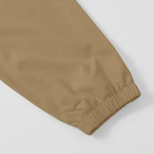 Detailed macro shot of khaki men's cargo pants featuring high-quality elasticated cuffs