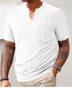 Close-up detail of a white textured Henley T-shirt featuring a V-neck and chest pocket