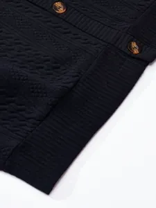 Close-up of black V-neck knit cardigan jacket showing jacquard texture and buttons
