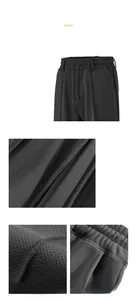 Close-up view of breathable fabric texture and drawstring waist on men's sports shorts.