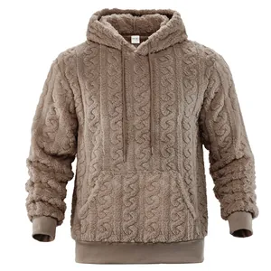 Close-up view of a men's brown cable knit textured fleece hoodie featuring hood drawstrings