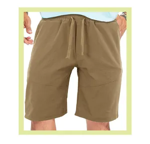 Detailed macro view of men's trendy khaki sports shorts with drawstring and elastic waistband