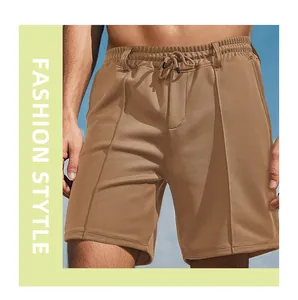 Detail view of men's breathable brown sports shorts featuring an elastic drawstring waist.