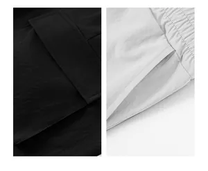 Primo piano della tasca e dell'elastico in vita dei pantaloncini da corsa leggeri da uomo