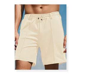 Close-up of beige men's athletic shorts featuring breathable waffle knit fabric