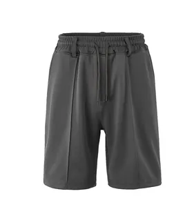 Detailed view of men's dark grey breathable athletic shorts with elastic drawstring waist.