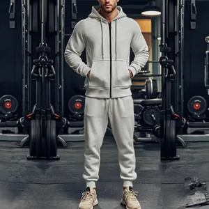 Tuta sportiva grigia da uomo con felpa con cappuccio e zip per fitness e palestra.