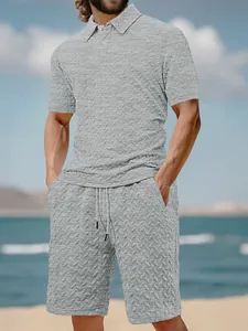 Casual men's grey textured knit polo shirt and matching shorts summer set outdoors
