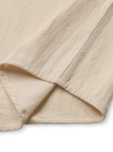 Detailed view of breathable linen fabric and hem stitching on men's casual t-shirt
