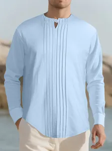 Detailed macro view of light blue long-sleeved pleated Henley shirt with linen texture for men