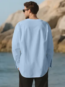 Back view of a light blue linen shirt for men featuring a relaxed fit and texture