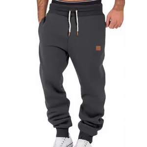 Classic charcoal grey men's joggers featuring a drawstring waist and elastic cuffed ankles