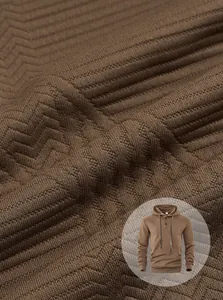 Vue macro détaillée du tissu texturé jacquard marron pour sweat à capuche décontracté