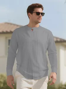 Detailed view of men's grey long-sleeved henley shirt featuring pleated center panel