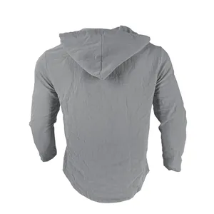 Back view of grey linen hooded long-sleeve shirt showing detailed fabric texture