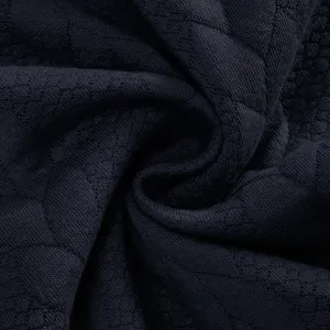 Makroaufnahme von marineblauem Jacquard-Strickstoff mit strukturierter Webung