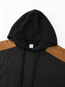 Close-up of the quilted square pattern and hood on this men's casual sports sweatshirt