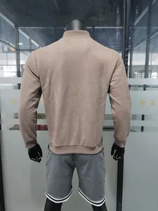 Back view of men's minimalist camel suede jacket with ribbed stand collar detail