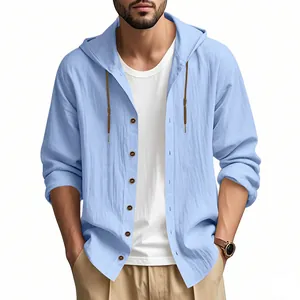 Close-up of light blue linen hooded shirt with textured fabric and button details