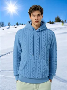 Men's light blue cable-knit textured fleece hoodie with front pocket in snow setting