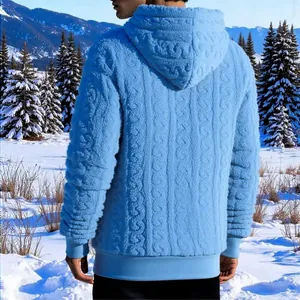 Back view of blue jacquard fleece hooded sweatshirt for men in snowy winter setting