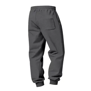 Detailed back view of heavyweight grey men's sweatpants with elastic cuffs and back pocket.