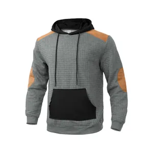 Men's casual grey quilted hoodie with black pocket and contrast shoulder patches detail
