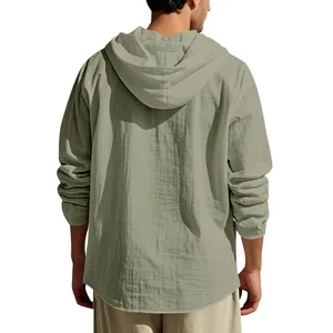 Back view of olive green hooded linen shirt showing natural fabric texture.