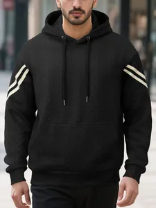 Detailed view of a black men's heavyweight jacquard hoodie featuring cream sleeve stripes.