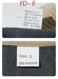 Close-up detail of the 100% polyester material label and size L tag on a sweatshirt.