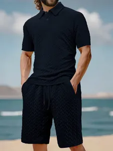 Close-up of men's summer leisure set featuring navy jacquard polo and matching shorts.