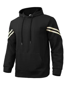 Detail of black jacquard textured hoodie with sleeve stripes and kangaroo pocket.