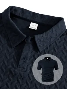 Close-up detail of men's navy blue jacquard polo shirt showing fabric texture and collar label