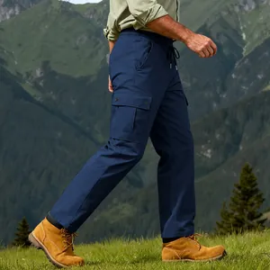 Outdoor side view of men's navy blue quick-dry cargo pants for hiking and climbing