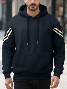 Detailed view of the navy jacquard hoodie showing the cable-knit texture and sleeve stripes