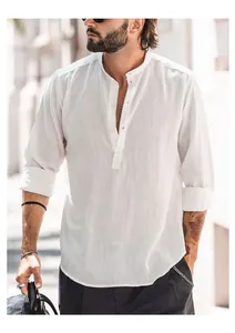 Close-up detail of white cotton linen Henley shirt with stand collar and long sleeves