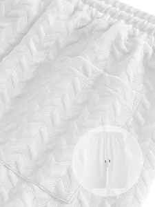 Macro shot of white chevron jacquard fabric texture on men's summer casual sports shorts