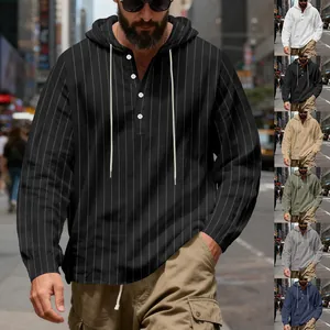 Detail view of men's striped hooded shirt with buttons and adjustable drawstring hem