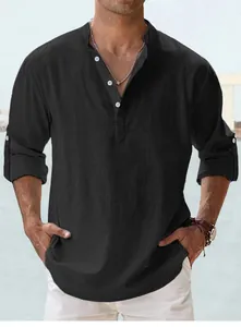 Close-up detail of black men's cotton Henley shirt with buttons and rolled-up sleeves