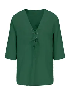 Close-up detail of dark green men's cotton linen V-neck shirt with lace-up front