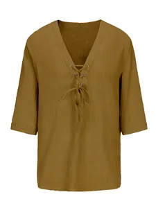 Detailed close-up of men's deep V-neck lace-up shirt made from breathable cotton linen fabric