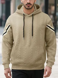 Detailed view of khaki heavyweight jacquard hoodie with sleeve stripes and black drawstrings.