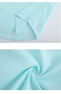 Macro view of premium light blue linen cotton fabric texture and hem stitching detail